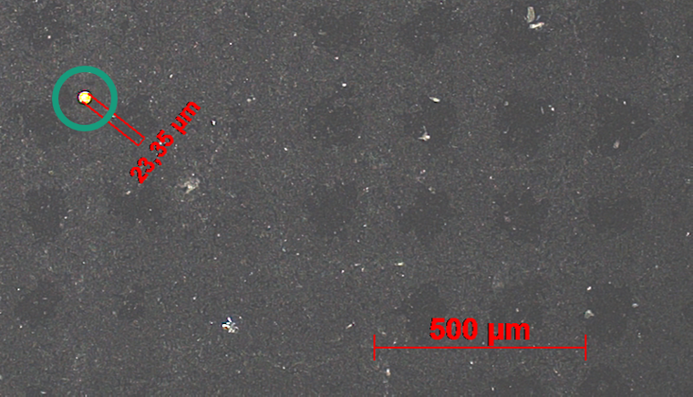Microscopy image showing one of the pinholes (23 µm) detected with H2-LIT.